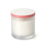 A scented candle in a glass jar