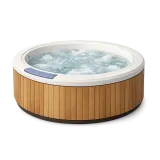 A round outdoor hot tub with wood surround