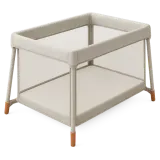 A travel cot, set up