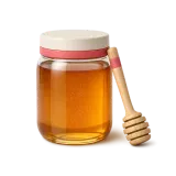 A jar of honey and a wooden dipper