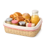 A breakfast basket: pastries, juice and jam